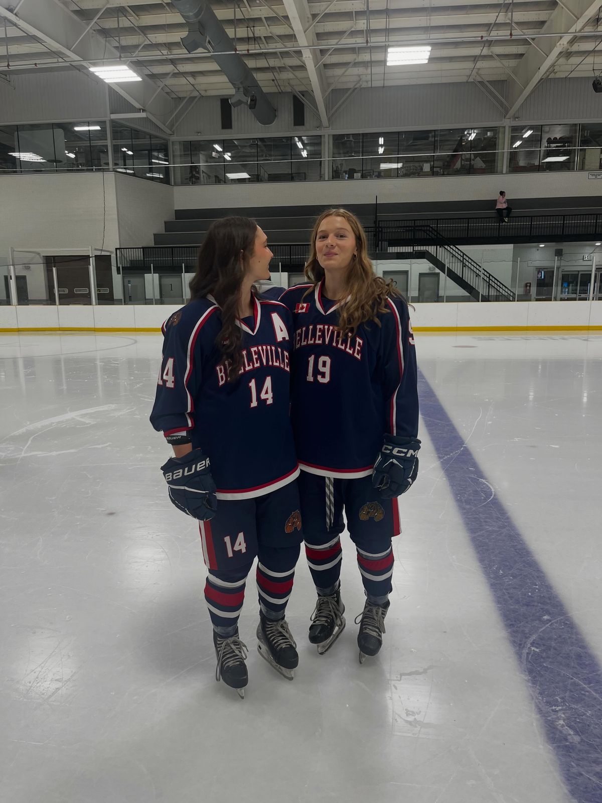 Rory (#19) with a Bearcats teammate at centre ice